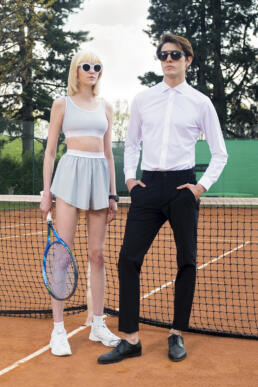andydonb man and girl models poses on tennis ground