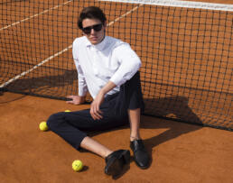 andydonb man sit on tennis ground